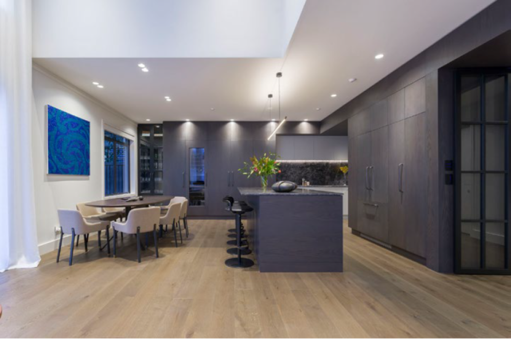 The open kitchen treats guests and residents to an array of contrasting colours and materials.